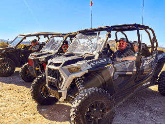 Adventure club riding three ATV .