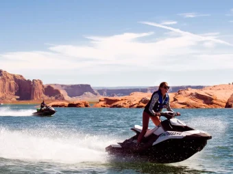 Two members of the Adventus Club enjoying jet skiing on the water